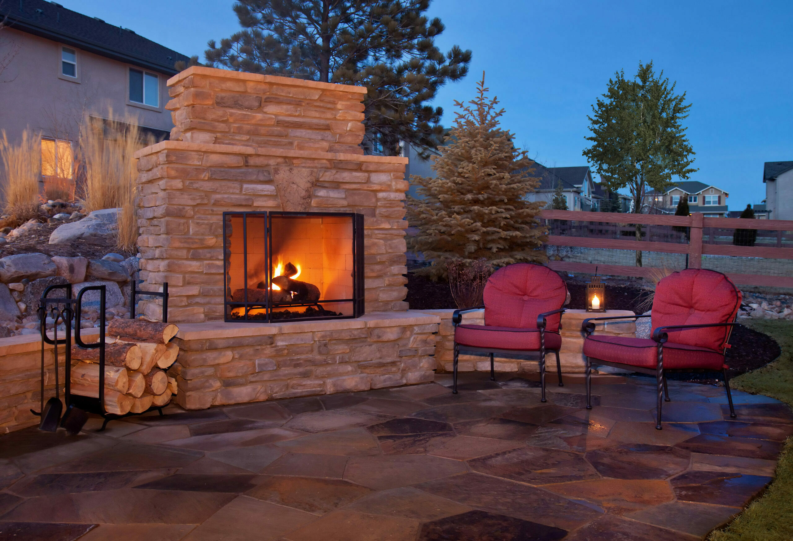 Outdoor flagstone platform with fireplace, chairs - TCC Materials