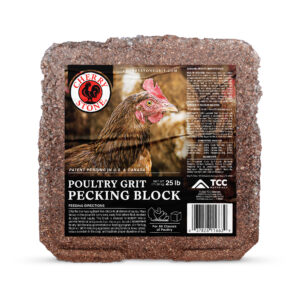Label on a poultry grit pecking block set against a rough brown rock surface, showing brand and product details in the foreground