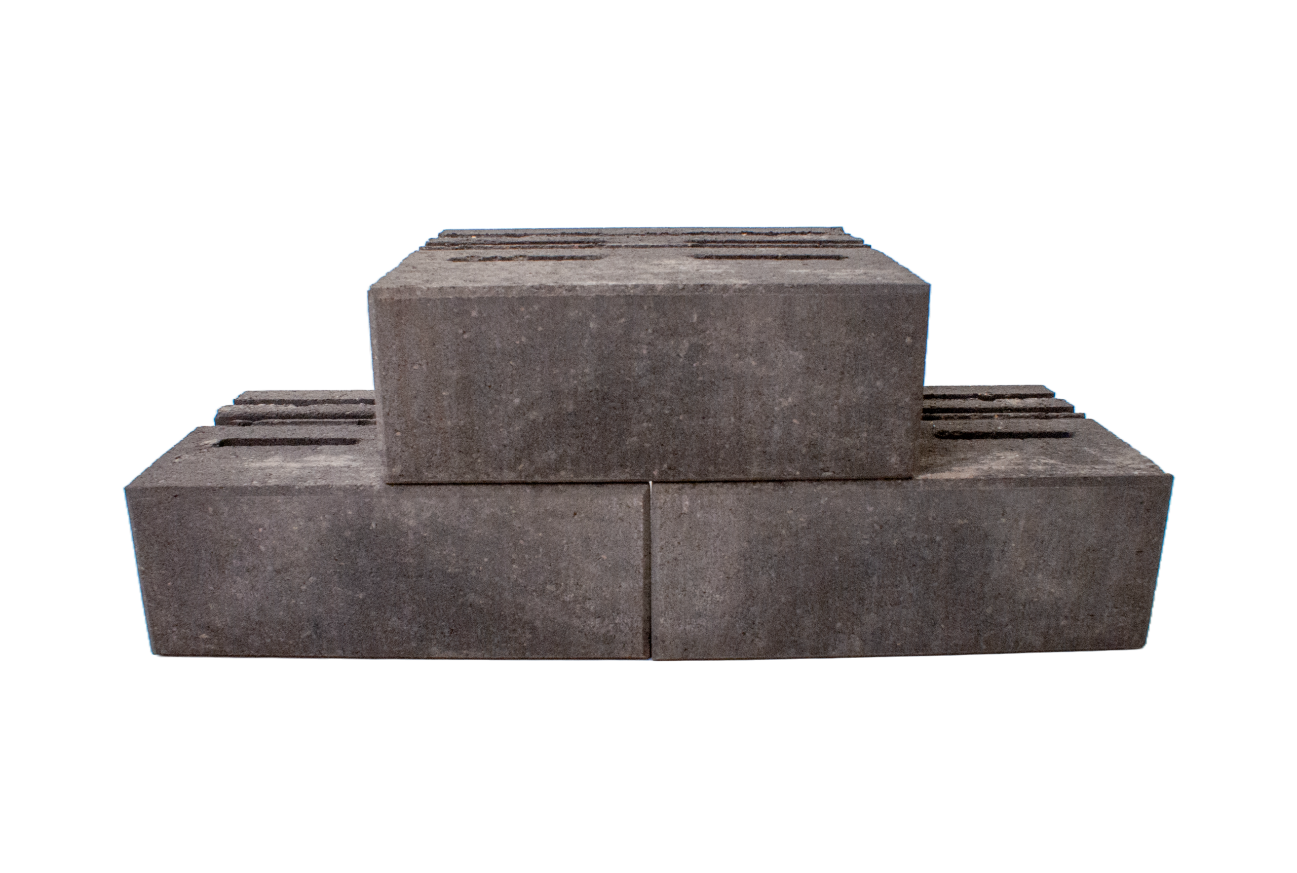 Stack of gray concrete cinder blocks arranged in a stepped formation, showing rough textured surfaces and hollow centers on top block (indoor studio shot).